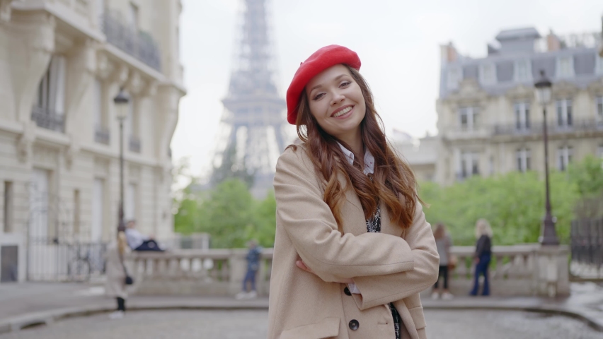 Cinematic footage of a young woman wearing fashionable clothes having fun in Paris at the eiffel tower park and streets. Concept about european tourism and travels to the capital cities | Shutterstock HD Video #1091594373