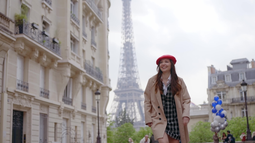 Cinematic footage of a young woman wearing fashionable clothes having fun in Paris at the eiffel tower park and streets. Concept about european tourism and travels to the capital cities | Shutterstock HD Video #1091594385