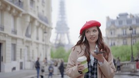 Cinematic footage of a young woman wearing fashionable clothes having fun in Paris at the eiffel tower park and streets. Concept about european tourism and travels to the capital cities