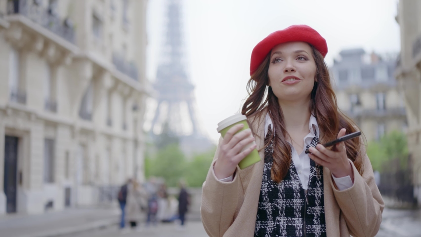 Cinematic footage of a young woman wearing fashionable clothes having fun in Paris at the eiffel tower park and streets. Concept about european tourism and travels to the capital cities | Shutterstock HD Video #1091594391