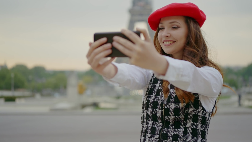 Cinematic footage of a young woman wearing fashionable clothes having fun in Paris at the eiffel tower park and streets. Concept about european tourism and travels to the capital cities | Shutterstock HD Video #1091594395