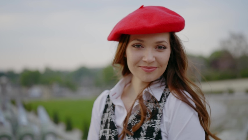 Cinematic footage of a young woman wearing fashionable clothes having fun in Paris at the eiffel tower park and streets. Concept about european tourism and travels to the capital cities | Shutterstock HD Video #1091594401