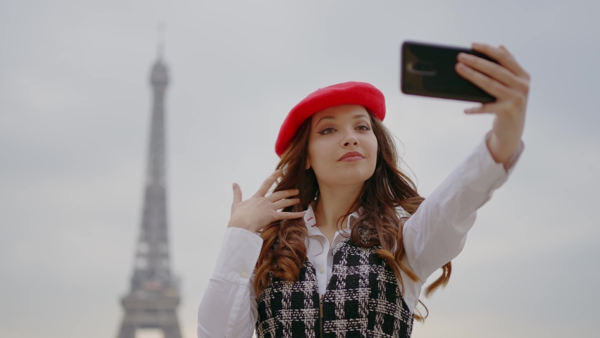Cinematic footage of a young woman wearing fashionable clothes having fun in Paris at the eiffel tower park and streets. Concept about european tourism and travels to the capital cities | Shutterstock HD Video #1091594411