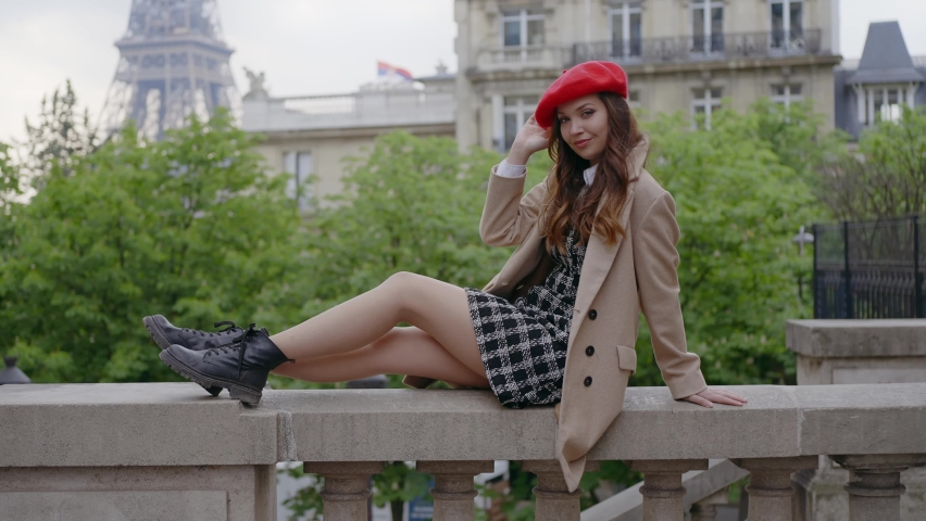Cinematic footage of a young woman wearing fashionable clothes having fun in Paris at the eiffel tower park and streets. Concept about european tourism and travels to the capital cities | Shutterstock HD Video #1091594417