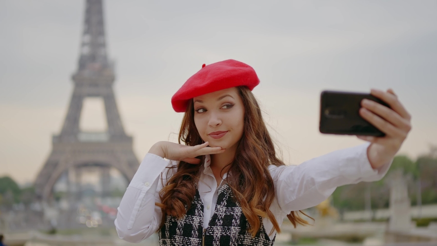 Cinematic footage of a young woman wearing fashionable clothes having fun in Paris at the eiffel tower park and streets. Concept about european tourism and travels to the capital cities | Shutterstock HD Video #1091594423
