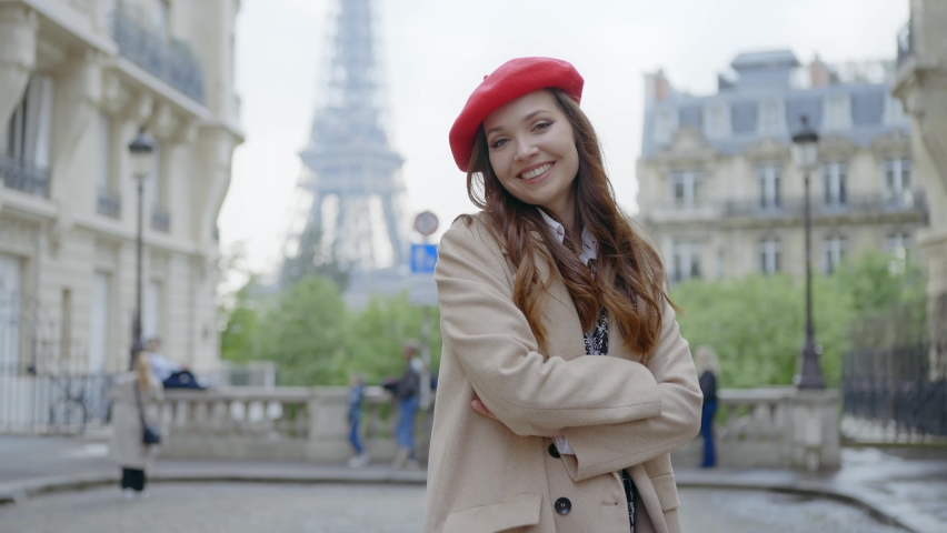 Cinematic footage of a young woman wearing fashionable clothes having fun in Paris at the eiffel tower park and streets. Concept about european tourism and travels to the capital cities | Shutterstock HD Video #1091594433