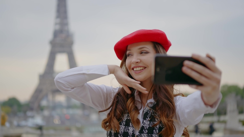 Cinematic footage of a young woman wearing fashionable clothes having fun in Paris at the eiffel tower park and streets. Concept about european tourism and travels to the capital cities | Shutterstock HD Video #1091594437