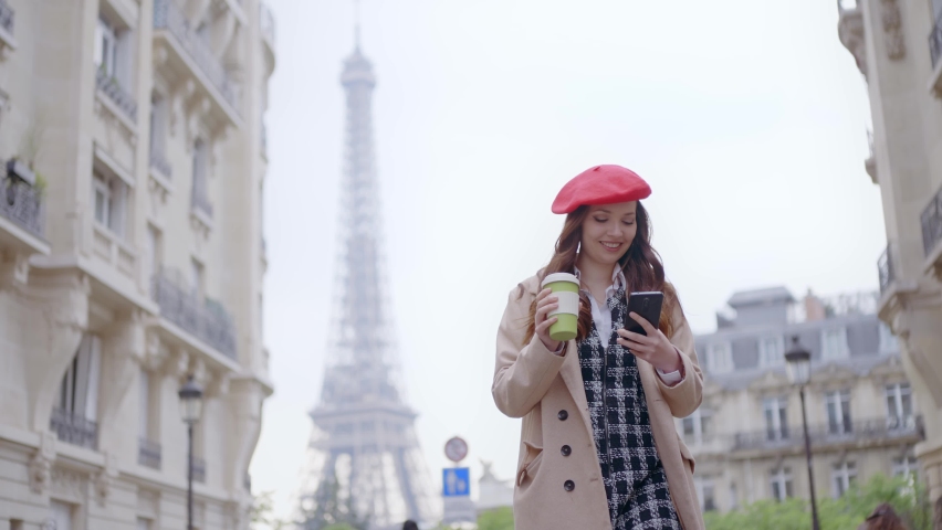 Cinematic footage of a young woman wearing fashionable clothes having fun in Paris at the eiffel tower park and streets. Concept about european tourism and travels to the capital cities | Shutterstock HD Video #1091594445