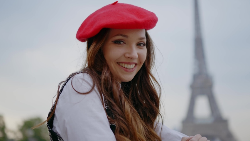 Cinematic footage of a young woman wearing fashionable clothes having fun in Paris at the eiffel tower park and streets. Concept about european tourism and travels to the capital cities | Shutterstock HD Video #1091594447