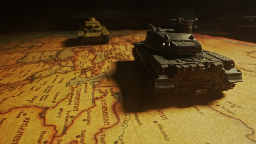 Toy tanks on the map. Military operations in Ukraine. Royalty-Free Stock Footage #1091603391