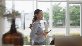 Asia people digital nomad adult female relax smile read social media app online chat text message look at mobile phone hold takeaway hot drink to-go zero waste cup enjoy coffee break at office outside - Powered by Shutterstock - Get 15% off with code: PIKWIZARD15