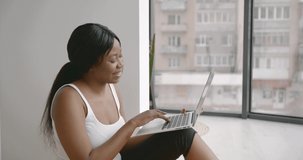 Black woman having video call on laptop