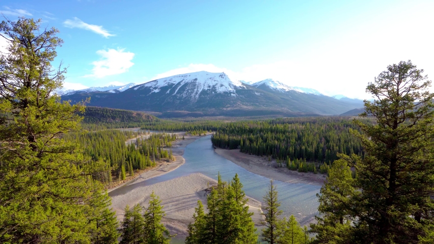 Canadian Rockies Jasper National Park landscape background. Athabasca River, Whistlers Peak nature scenery in late spring to summer. Alberta, Canada.