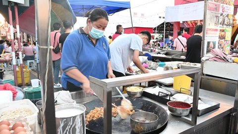 Melaka  Malaysia - 25th June 2022: A man is preparing food at Jonker Street.