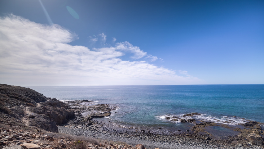 A timelapse of a beautiful pebble beach in gran canaria | Shutterstock HD Video #1091612765