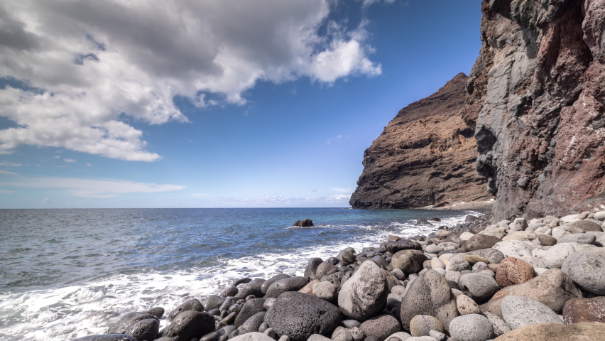 A timelapse of a beautiful pebble beach in gran canaria | Shutterstock HD Video #1091612769