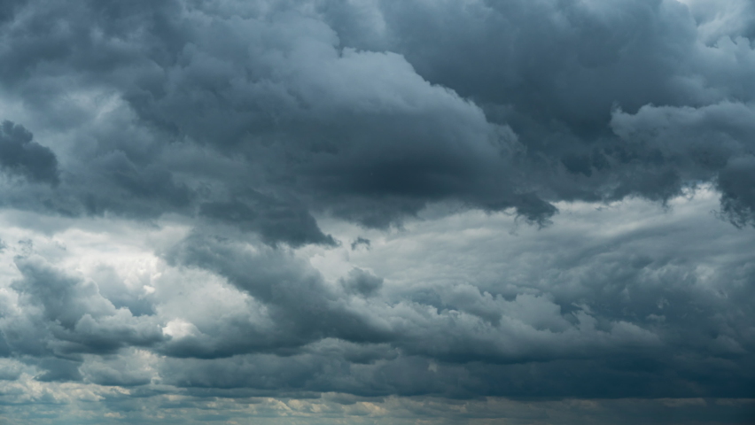 Timelapse gray rainy clouds float across the dark sky on a cloudy day. Cloudy sky and gloomy clouds. Magic dramatic sky in rainy weather. Ominous clouds slowly drift across the sky, threatening rain. | Shutterstock HD Video #1091616253