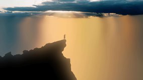 The sun's rays breaking through storm clouds and shining down on the silhouette of a person standing up high on a cliff edge. - Powered by Shutterstock - Get 15% off with code: PIKWIZARD15