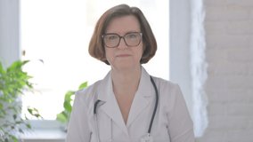 Senior Female Doctor Talking on Online Video Call