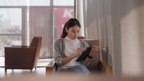 Digital transformation hybrid office workplace work anywhere. Adult talent workforce asia people write note or read reskill upskill e-book learn online relax sit at cafes coffee shop by 5G wifi IOT. - Powered by Shutterstock - Get 15% off with code: PIKWIZARD15