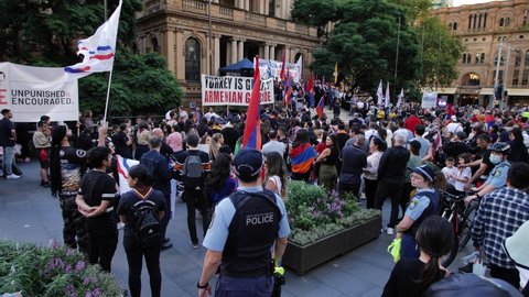 SYDNEY, NSW, AUSTRALIA. APRIL 24 2022. Hundreds attend anti Turkey demonstration in the heart of Sydney, slow motion. Australian-Armenian community hold marches for justice on Genocide Remembrance Day