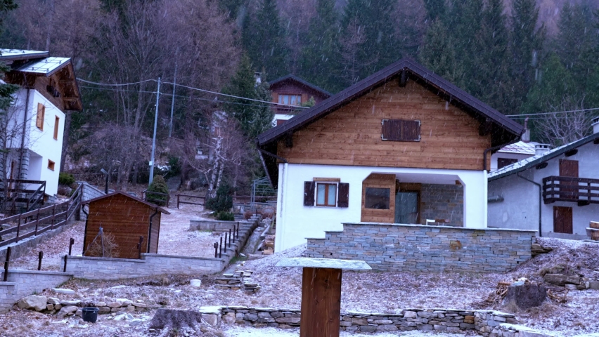 Winter ski resort town during cloudy weather. Beautiful ski resort in Italian Alps.