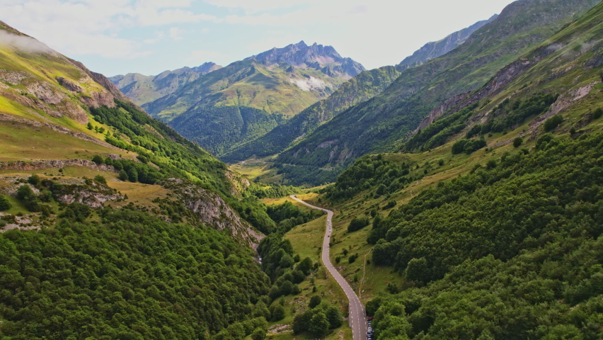 Wide Slow Motion Drone Shot Over Road In The French Pyrenees Mountain Range, Occitanie, France Royalty-Free Stock Footage #1091634007