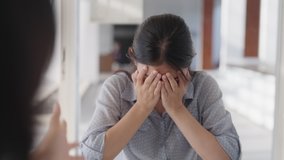 Great resignation fatigue workforce crisis toxic workplace issue. Bored sad annoy team asia two people bad anger yell tired sit at office table talk rude to staff worker in wrong project refuse reject - Powered by Shutterstock - Get 15% off with code: PIKWIZARD15