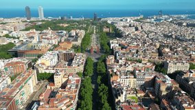 Aerial view of Barcelona Urban Skyline and The Arc de Triomf or Arco de Triunfo in spanish, a triumphal arch in the city of Barcelona. Passeig de Lluís Companys during a sunny day