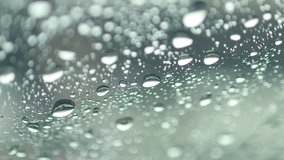rain drops on car windshield, water drop, raindrops on the windshield car in the rainy season, selective focus, 4k videos