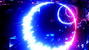 Round glow lines. Hi-tech neon sci-fi tunel. Trendy neon glow lines form pattern and construction in mirror tunnel. Fly through technology cyberspace. 3d almost looped 4k bright youth background.