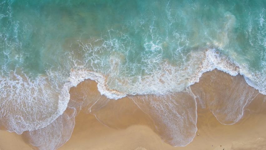 Aerial video beautiful closeup shot beach and seawater on wave on sand in sunset time (Top-view) nature and travel concept video. Royalty-Free Stock Footage #1091655301