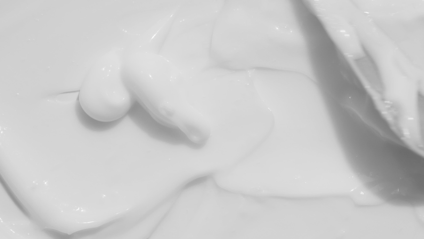 Skin care light creamy cosmetic beauty product smudge swipe closeup video. White cream texture footage. Moisturising creme swatch motion with spatula. Skincare cosmetics lotion mousse close up | Shutterstock HD Video #1091655711