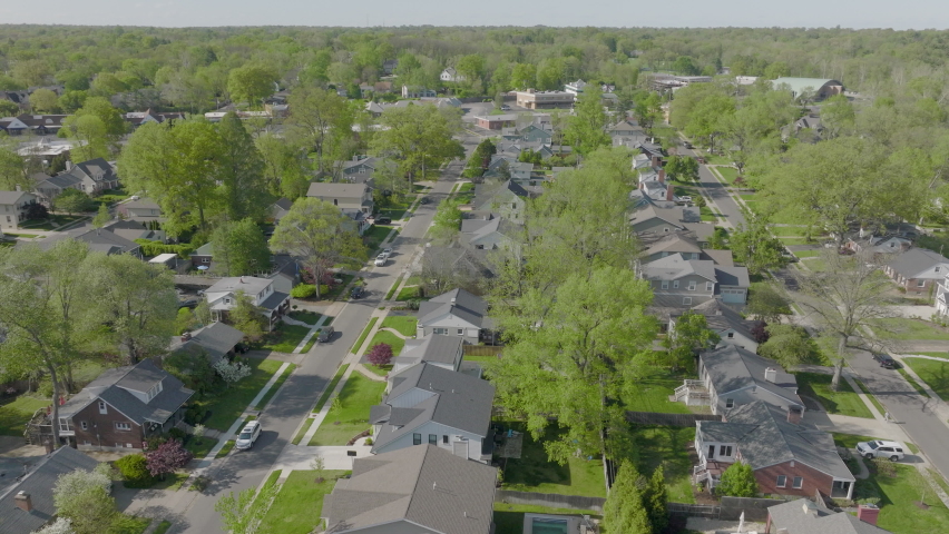 Slow push over a pretty neighborhood in St. Louis, Missouri on a spring day.
