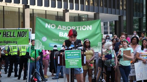 Chicago, Illinois - June 24 2022: Pro-choice pro-abortion protests in downtown Chicago after overturning of Roe v. Wade, person speaking up for the right to abortion in front of protesters