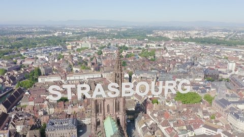 Inscription on video. Strasbourg, France. The historical part of the city, Strasbourg Cathedral. Glitch effect text, Aerial View