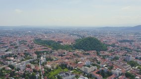 Inscription on video. Graz, Austria. The historic city center aerial view. Mount Schlossberg (Castle Hill). Blue lights form luminous. Electric style, Aerial View