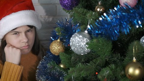 Child feel lonely at Christmas. A young teenager girl feel lonely and depressed during Christmas holiday.