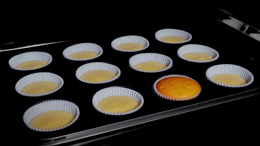 Timelapse, cinemagraph, loop - one of twelve cupcakes, muffins baking and rising in muffin tin in electric oven at home. Homemade bakery, food, cooking, pastry and time lapse concept | Shutterstock HD Video #1091663377