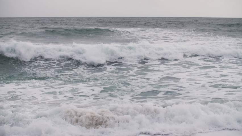 Waves on a cloudy day in the ocean | Shutterstock HD Video #1091664007