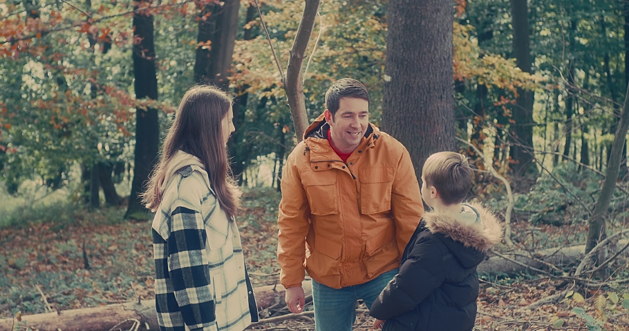 Happy family outdoors while spending his free time, Father and children are happy to walk park, Parents hold the child by the hands. Enjoy time together. Natural colors. | Shutterstock HD Video #1091666543