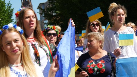June 25, 2022 - Offenburg, Germany: Ukrainians in national costumes with embroidered shirts with Ukrainian symbols and flags in demonstration support of Ukraine against war with Russia