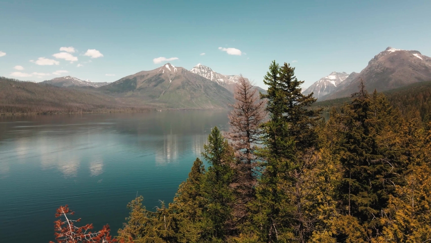 parrallax of Lake McDonald that is the largest lake in Glacier National Park 4k 60fps cinematic Royalty-Free Stock Footage #1091675799
