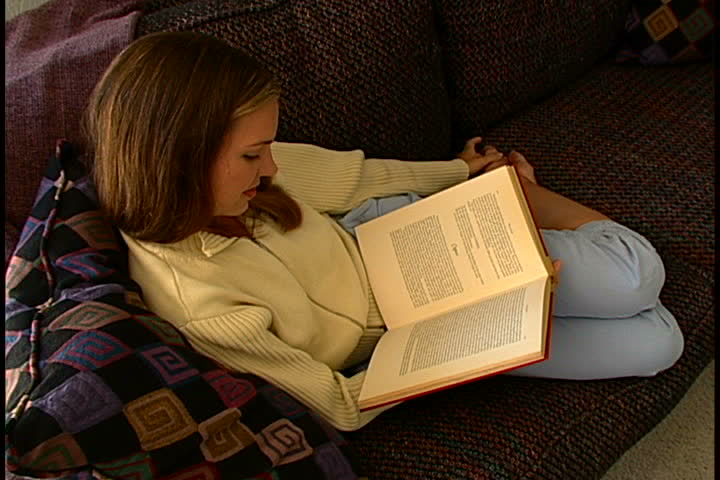 Woman Reading on Sofa