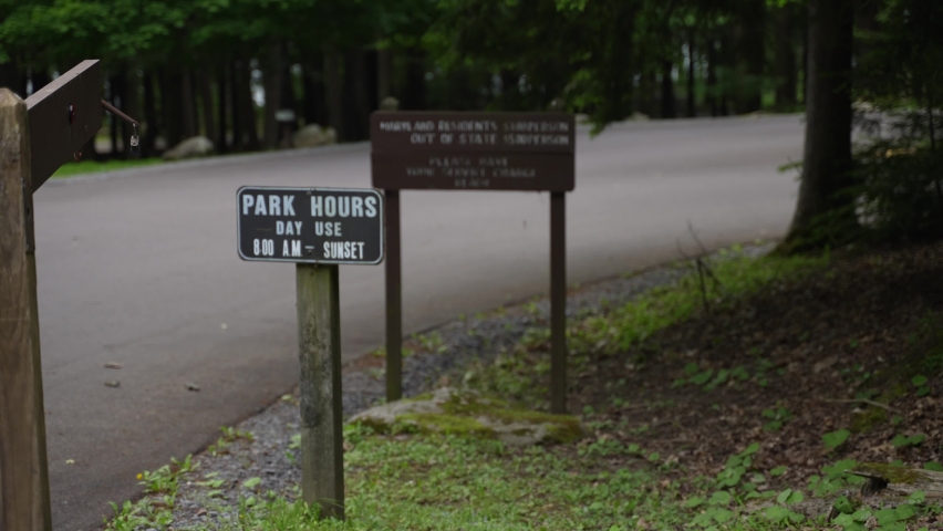 Sign at a state park in Maryland, MD, USA for Park Hours.