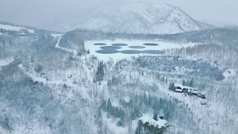 Snowmass village wilderness with hot springs and snowy landscape around. Aerial view of idyllic winter vacation destination with beautiful natural environment. High quality 4k footage