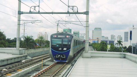 JAKARTA, INDONESIA - NOVEMBER 29, 2021: An MRT train leaves the ASEAN station heading towards the Bundaran HI . station