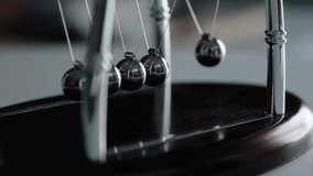 A smoky Newtons Cradle scene - Powered by Shutterstock - Get 15% off with code: PIKWIZARD15