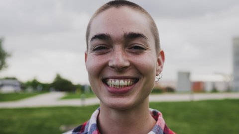 Shaved Head Girl Smiling Front Camera Stock Footage Video (100% Royalty