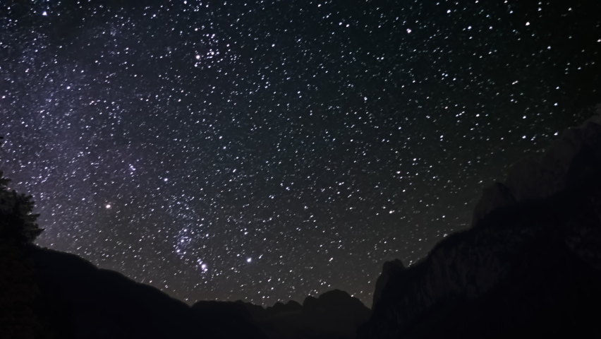 Time lapse starry sky moving over Dachstein massif and Gosau lake (Gosausee), Salzkammergut, Upper Austria. | Shutterstock HD Video #1091705951